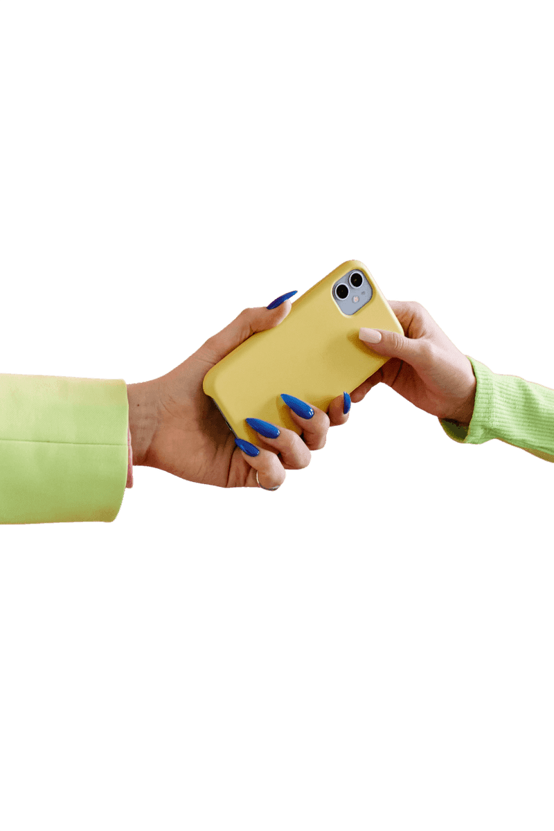 One hand passing a phone to another hand